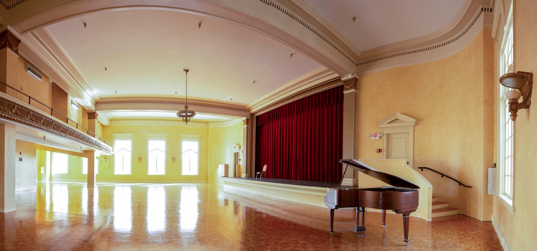 open hall with piano and stage
